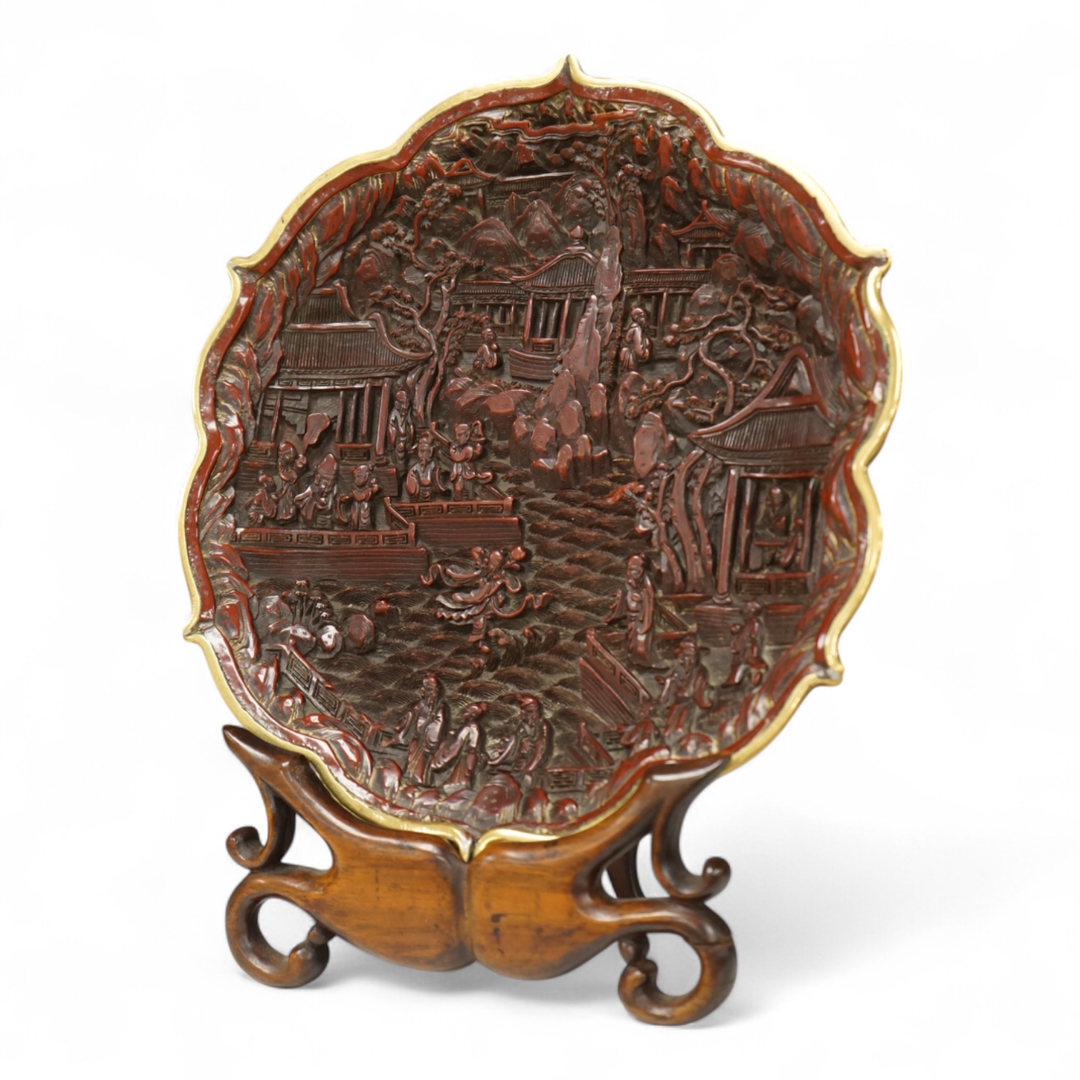 A Chinese lacquer foliate-shaped dish on stand, 18cm in diameter